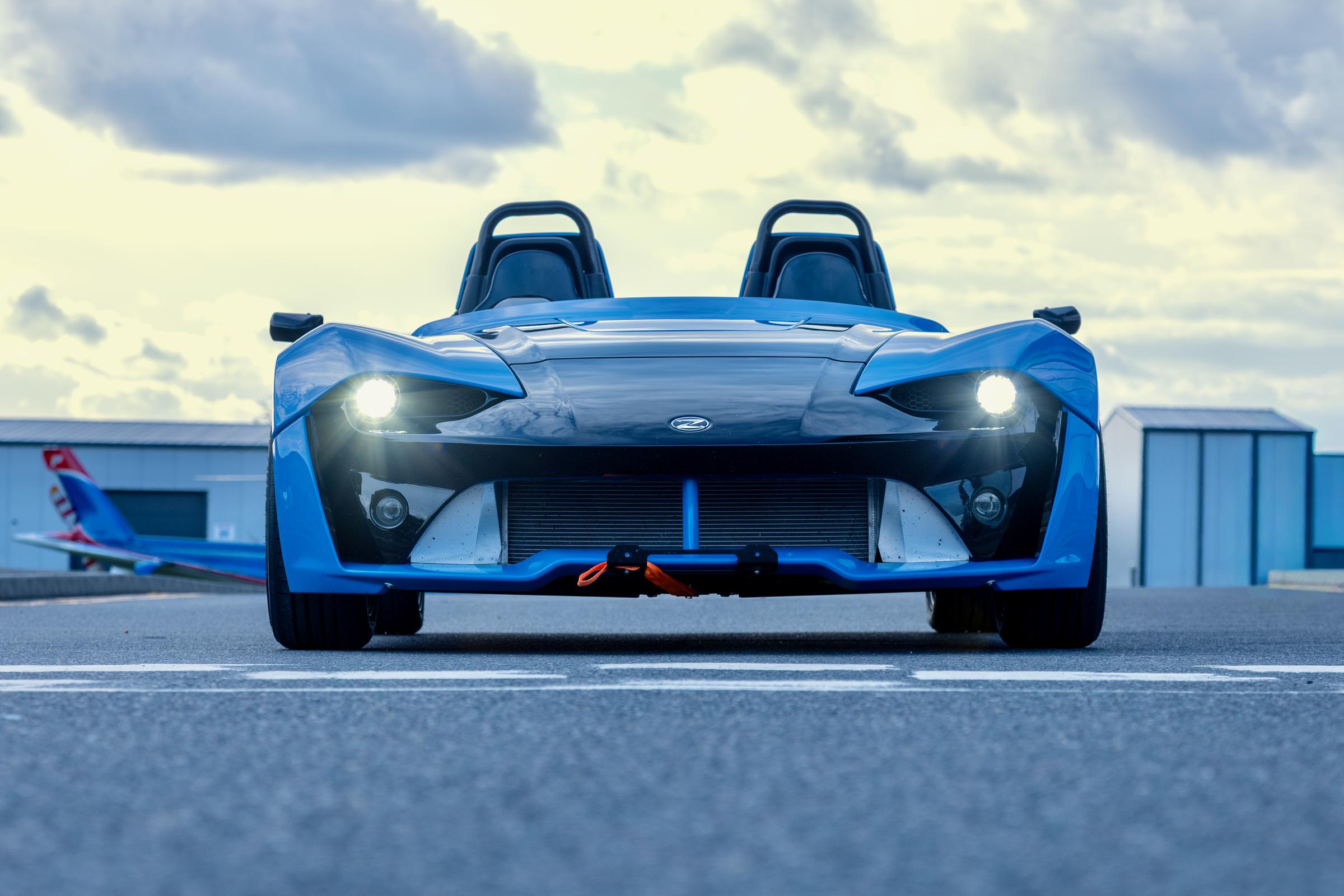 Zenos E10 front view, headlights on