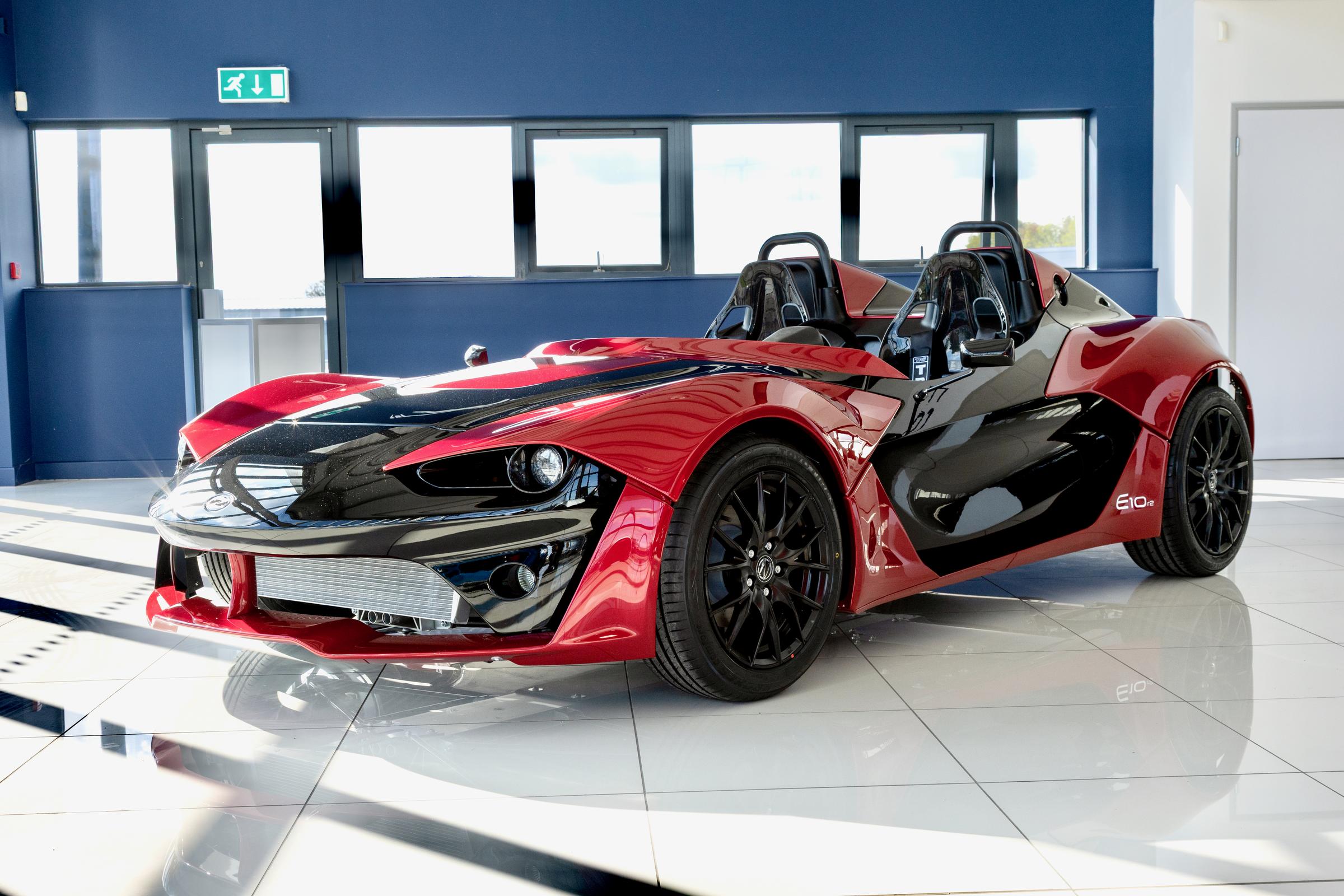 Red Zenos E10 in the showroom